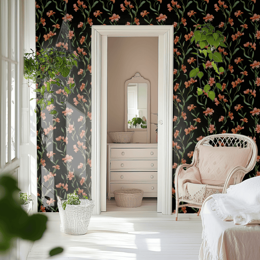 Tangerine Embroidery wallpaper with moody embroidered florals in tangerine on a black ground, shown installed on a living-room wall at room scale