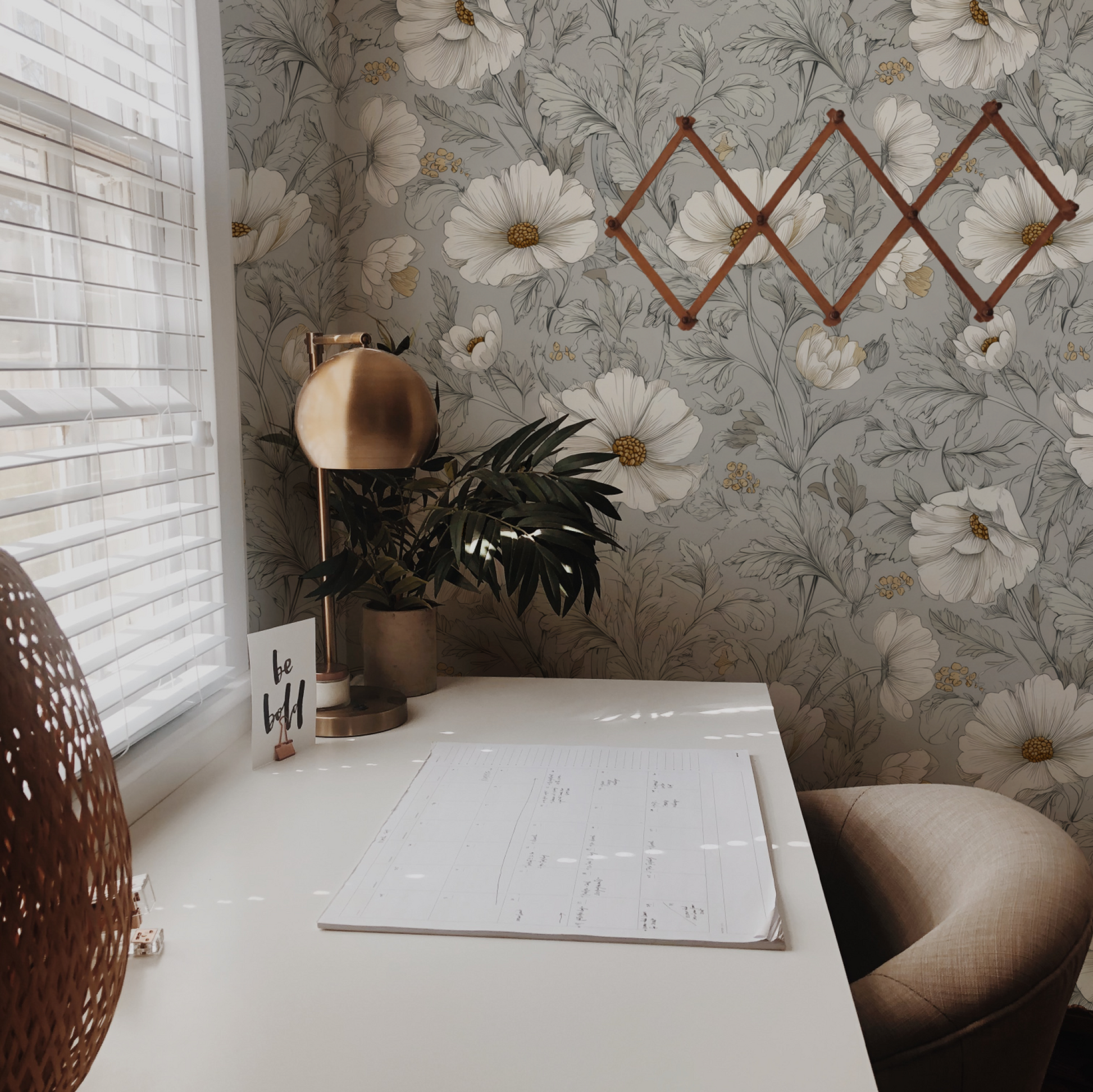 Grey Floral Wallpaper installed in a room interior with Arts and Crafts daisy botanical on a deep charcoal grey ground