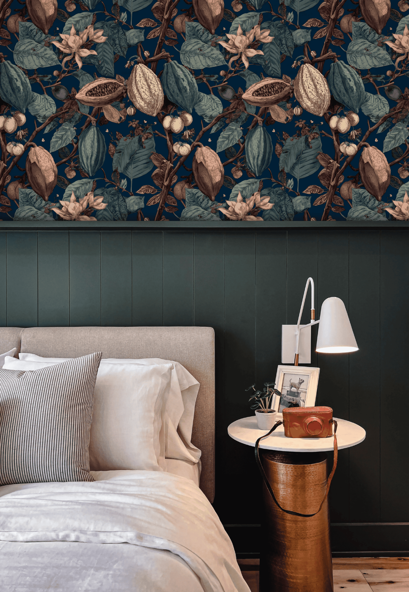 Blue Botanical Wallpaper installed in a room interior with dark academia dark botanical cacao plant on a deep blue ground