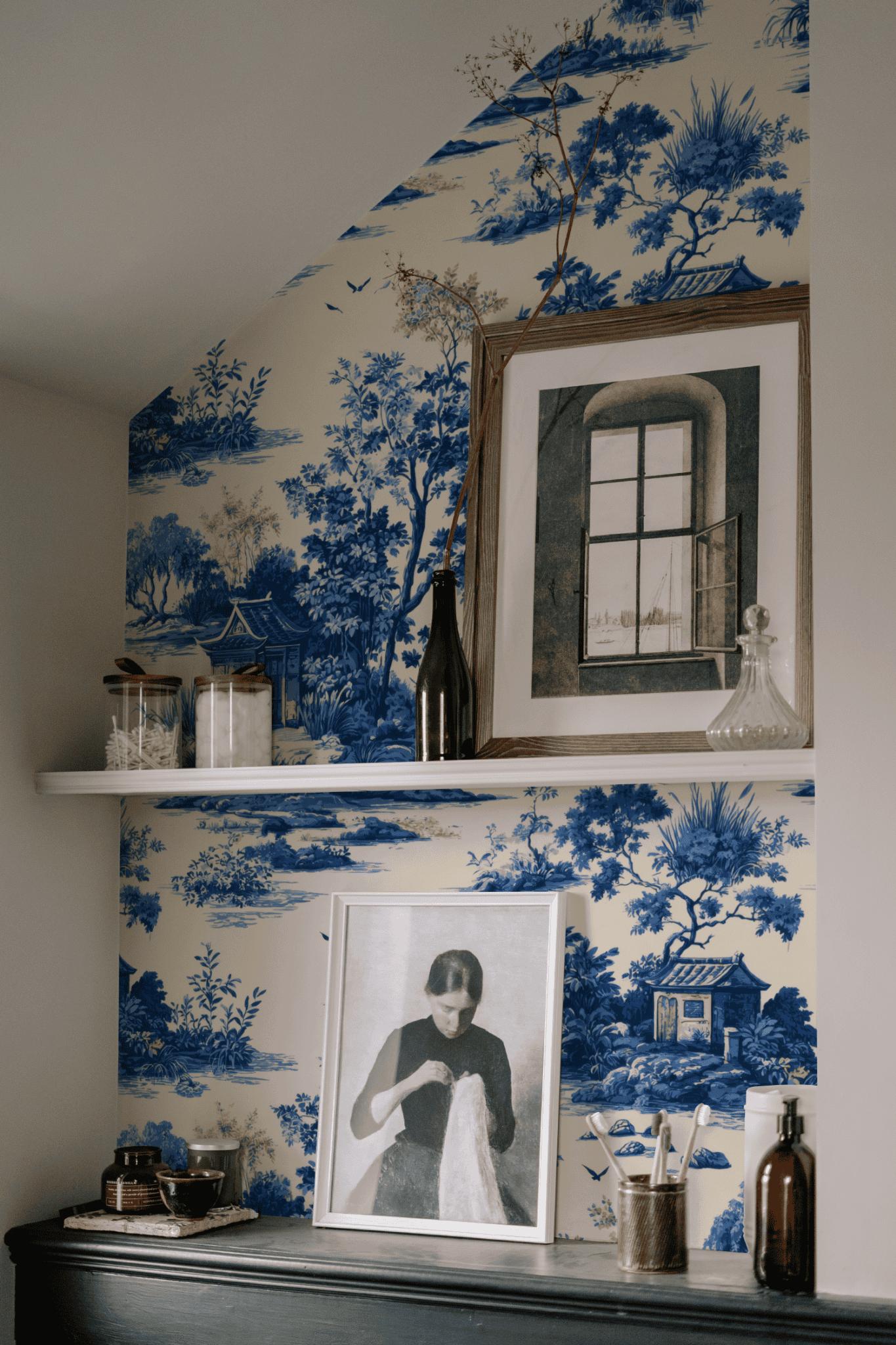 Blue Toile Wallpaper installed on a room wall with blue scenic toile of pavilions and Chinese landscape