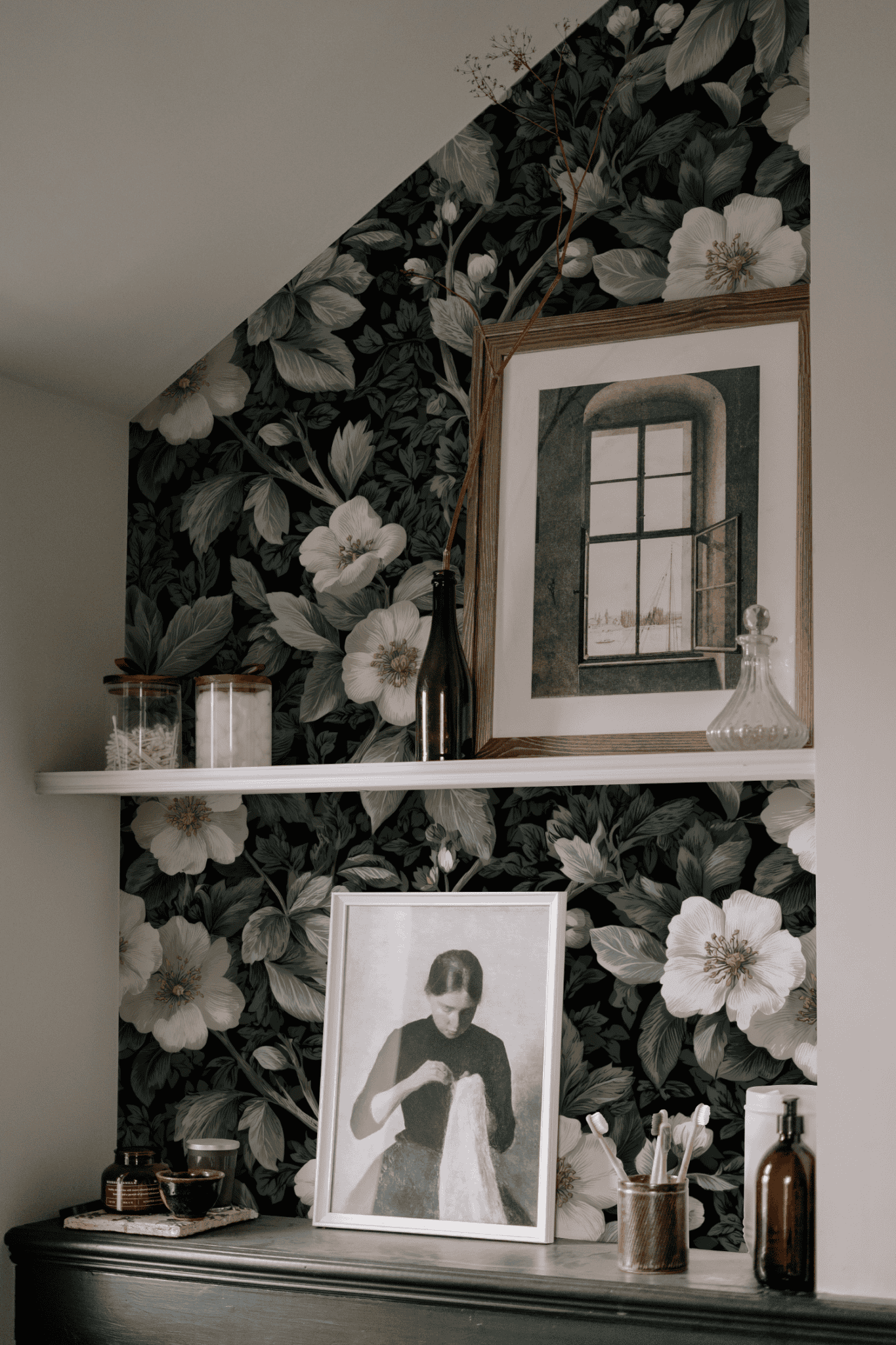 Green Floral Wallpaper installed on a room wall with dark academia moody floral pattern in chalky green and dark botanical drawing