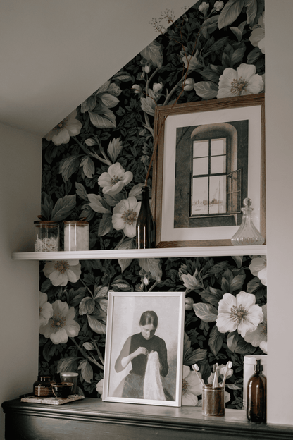 Green Floral Wallpaper installed on a room wall with dark academia moody floral pattern in chalky green and dark botanical drawing