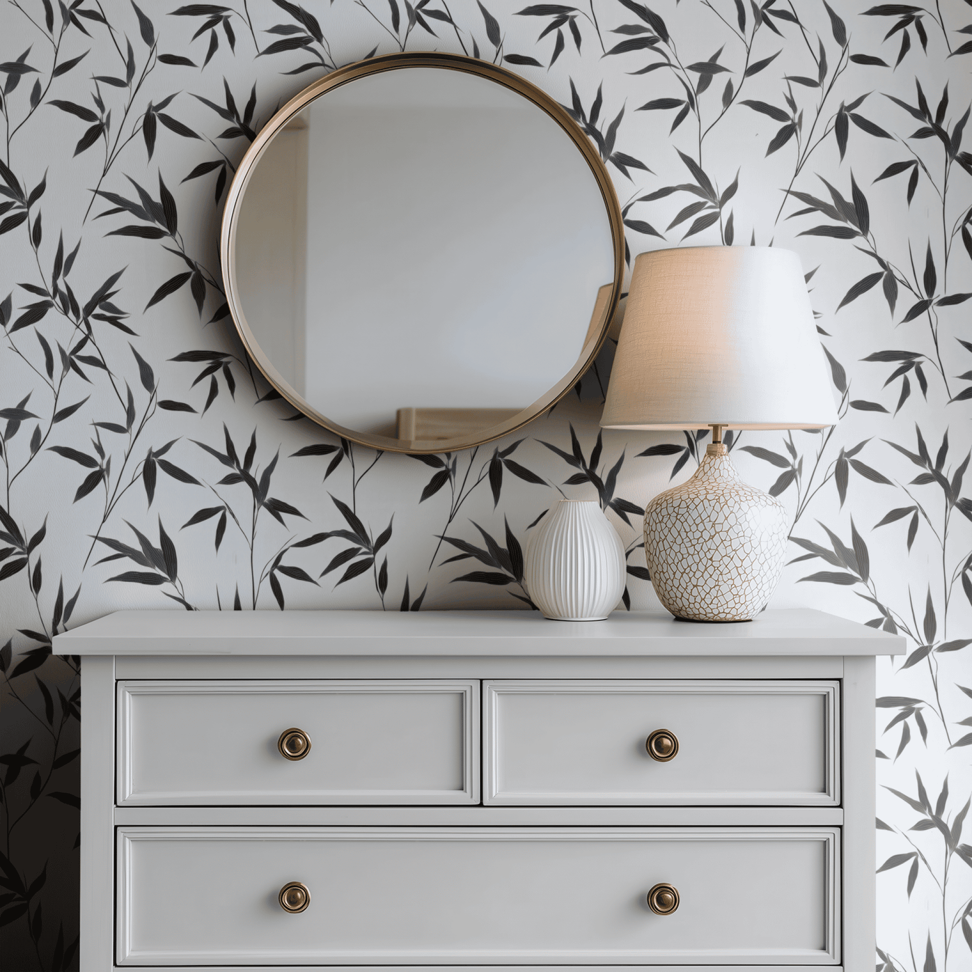 White Botanical Wallpaper shown in a second interior with the dark ebony foliage reading as graphic high-contrast decoration