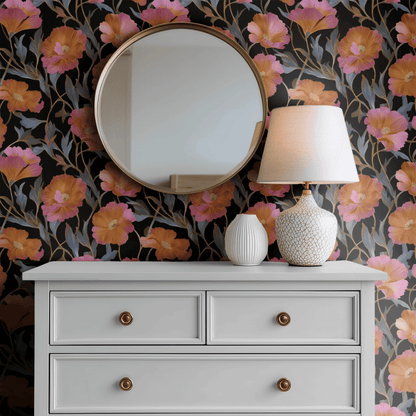 Black Floral Wallpaper installed in a second interior, the black ground reading atmospheric against warm wood and the amber florals catching lamp light