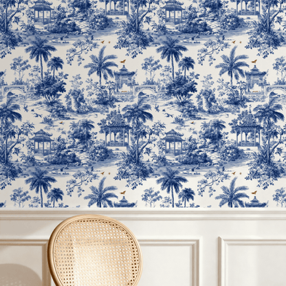 Blue Toile Wallpaper installed on a room wall with blue-and-white scenic toile pattern in monochrome ink