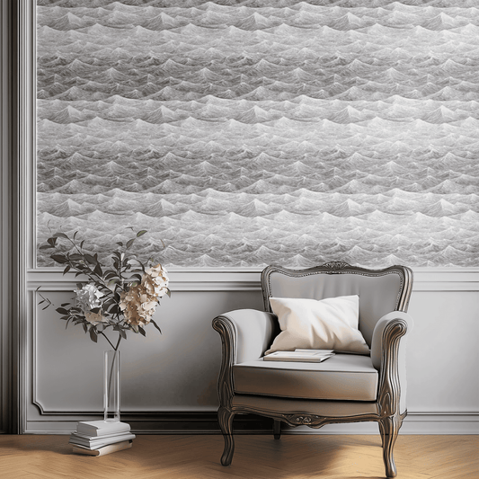 Sketched Ocean wallpaper with Mid-Century Modern monochrome sketched ocean wave pattern in grey, shown installed on a living-room wall at room scale