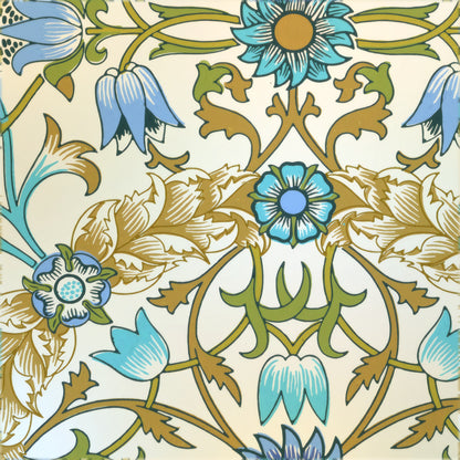 Turquoise flowers in symmetrical gold and olive scrolls on a cream ground, a William Morris design.