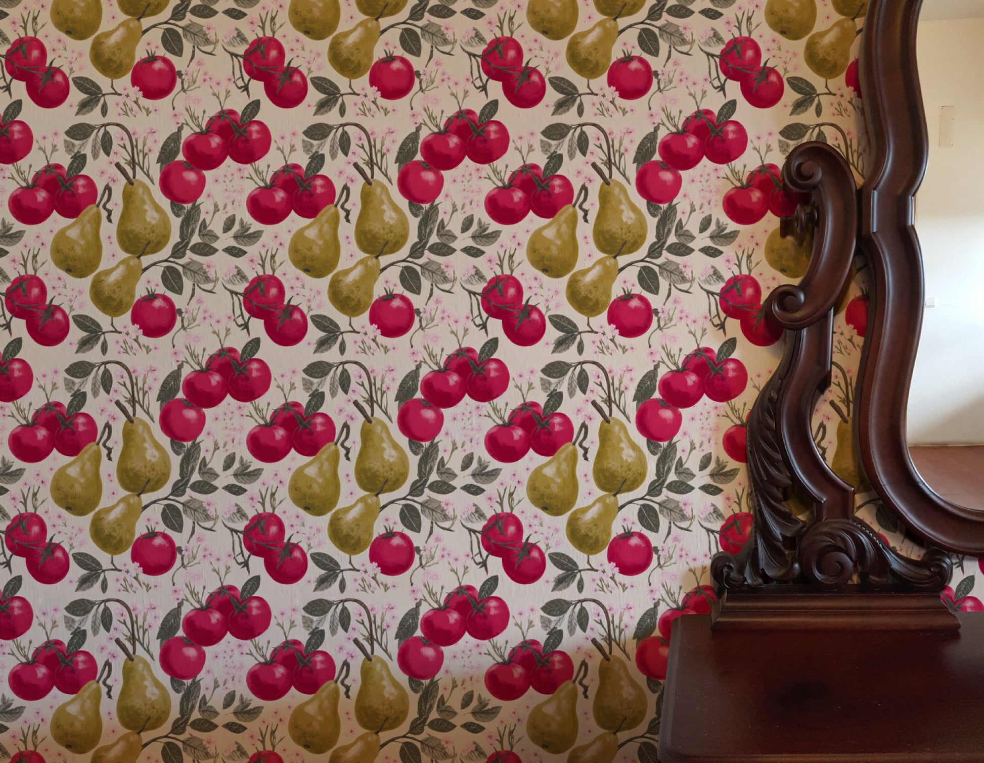 Crimson tomatoes and golden pears with pink cherry blossom on a warm cream ground in a lush fruit wallpaper. - room view