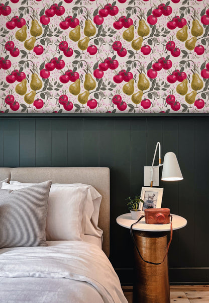 Crimson tomatoes and golden pears with pink cherry blossom on a warm cream ground in a lush fruit wallpaper. - room view