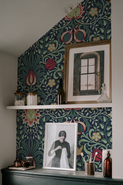 Red Floral Wallpaper installed on a room wall with the Morris Persian-inspired botanical design in heritage red