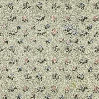 Small pink and blue flower sprigs scattered over pale sage leaves, a William Morris design.