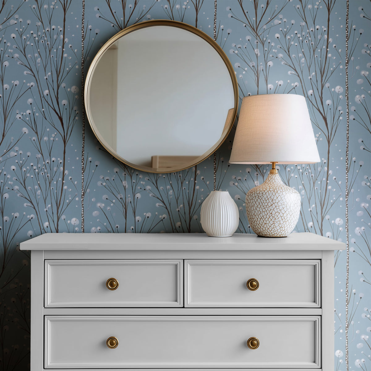 Silver Sprigs wallpaper on a wall above a dresser with a round mirror