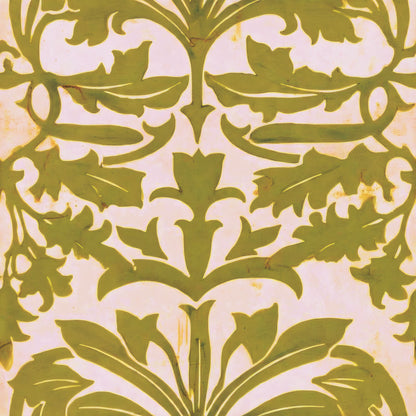 A bold symmetrical leaf and flower design in olive on a warm cream ground, a William Morris design.