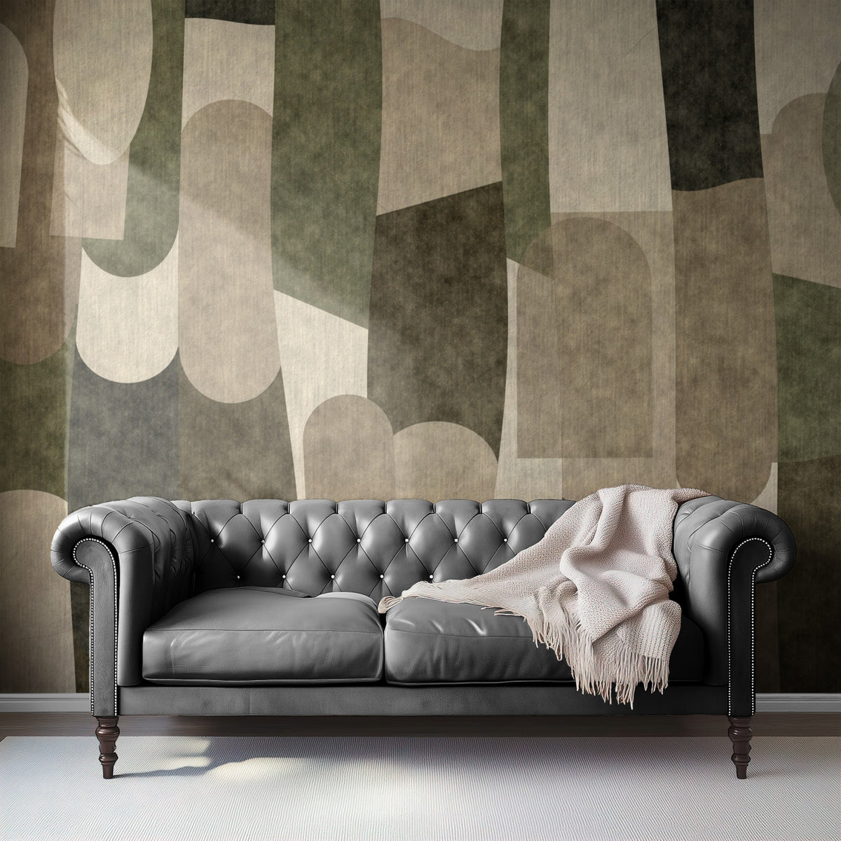 Stone Collage mural behind a grey leather chesterfield