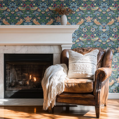 Blue Bird Pattern Wallpaper shown in a second room with the indigo Strawberry Thief reading as iconic Morris decoration in a calmer palette