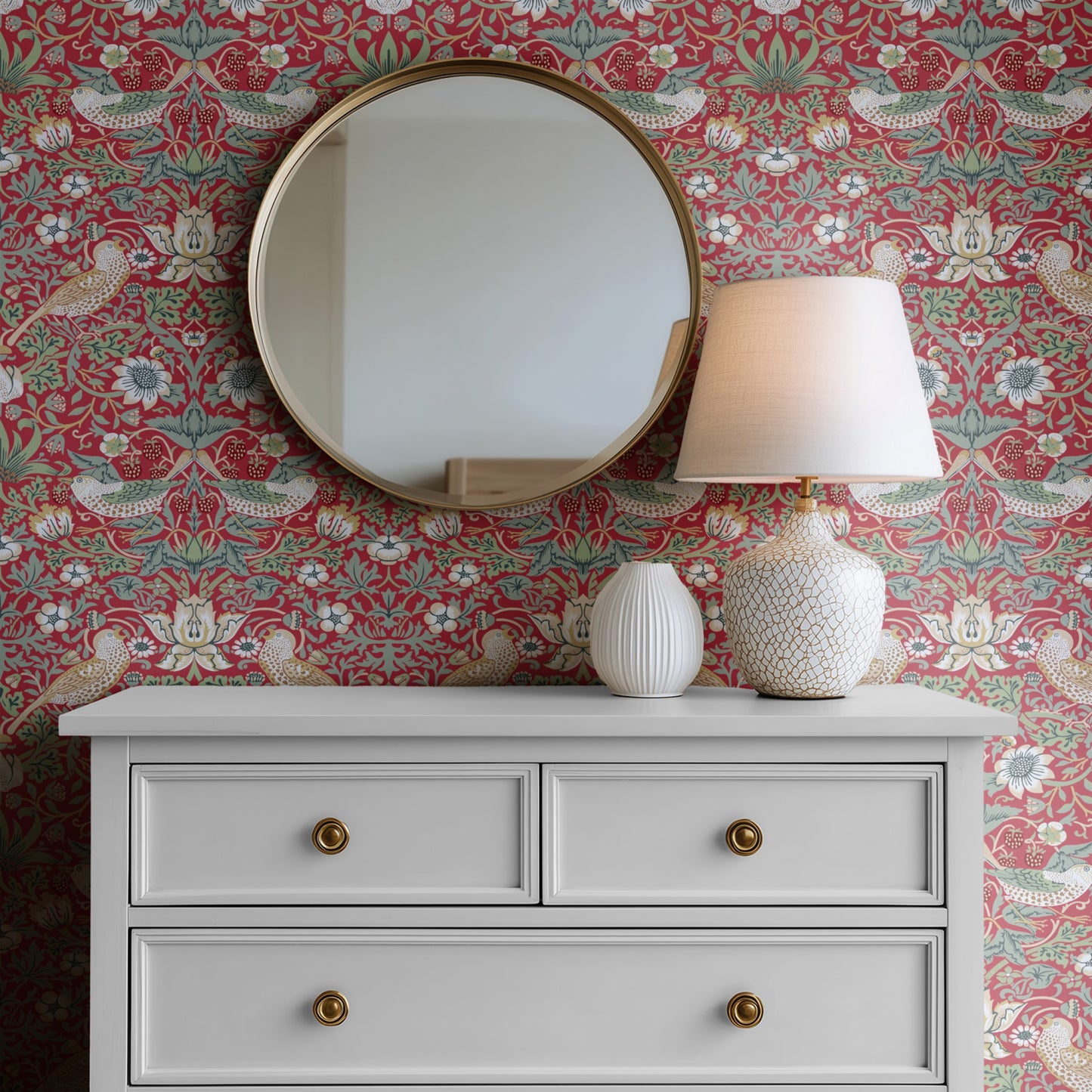 Red Bird Pattern Wallpaper shown in a second interior with the heritage red Strawberry Thief reading as the iconic Morris decoration in its original palette