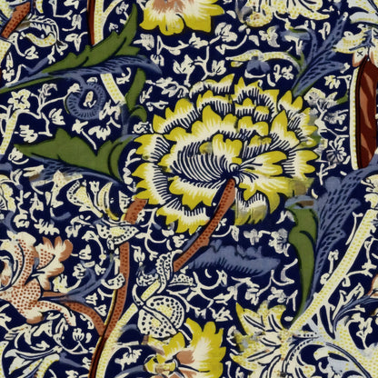Large yellow and white flowers and twisting stems over a dense navy and cream ground, a William Morris design.
