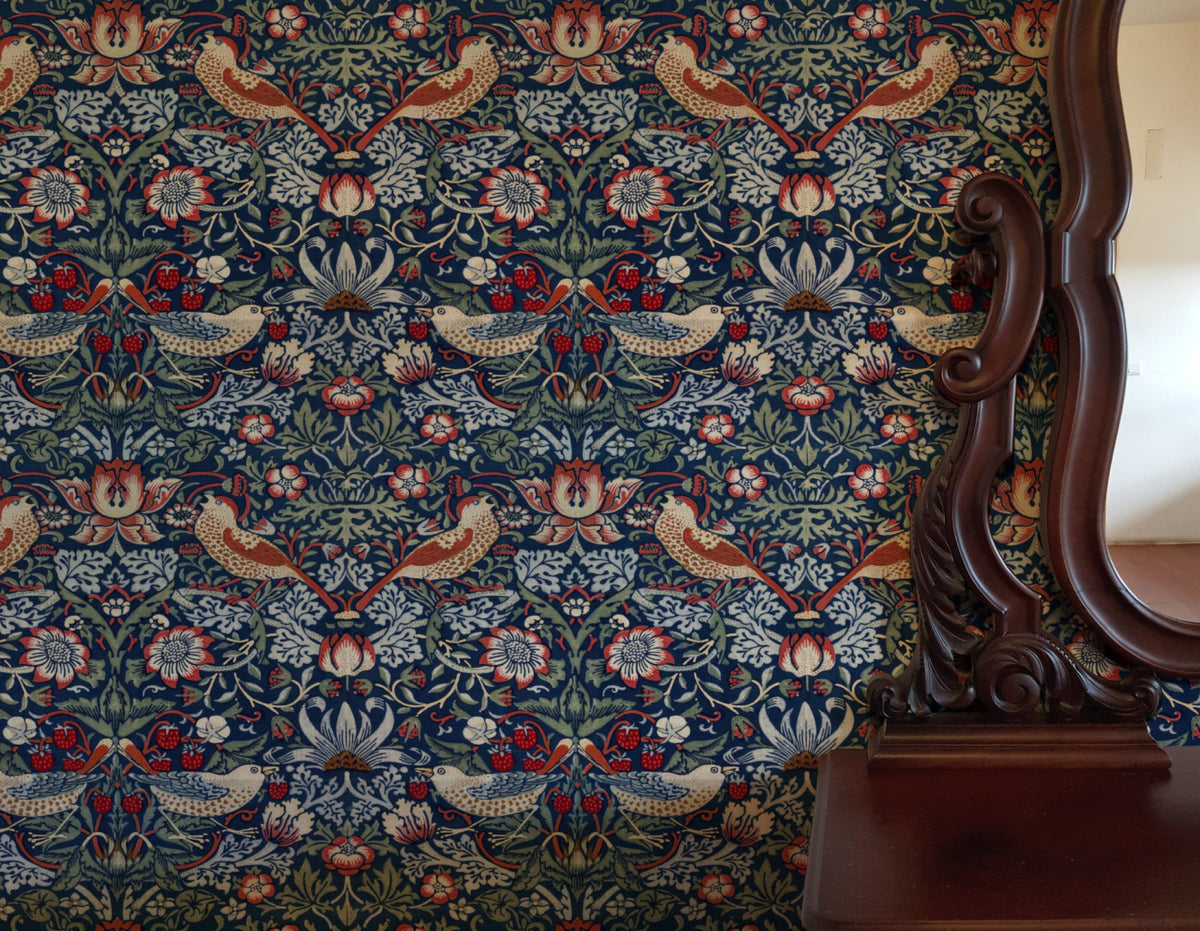 William Morris Strawberry Thief Indigo & Madder wallpaper in a styled room