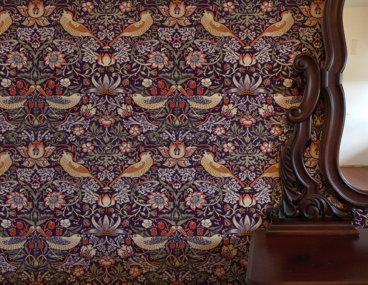 William Morris Strawberry Thief Plum & Ochre wallpaper in a styled room