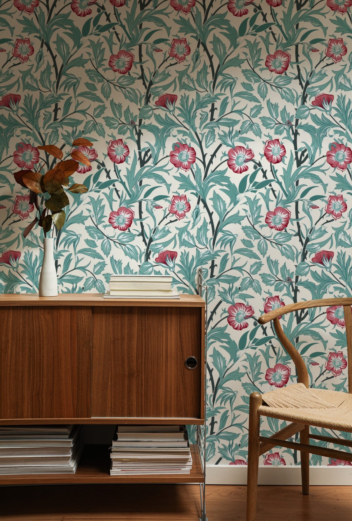 Red Floral Wallpaper installed on a room wall with the Morris sweet briar rose design in warm light