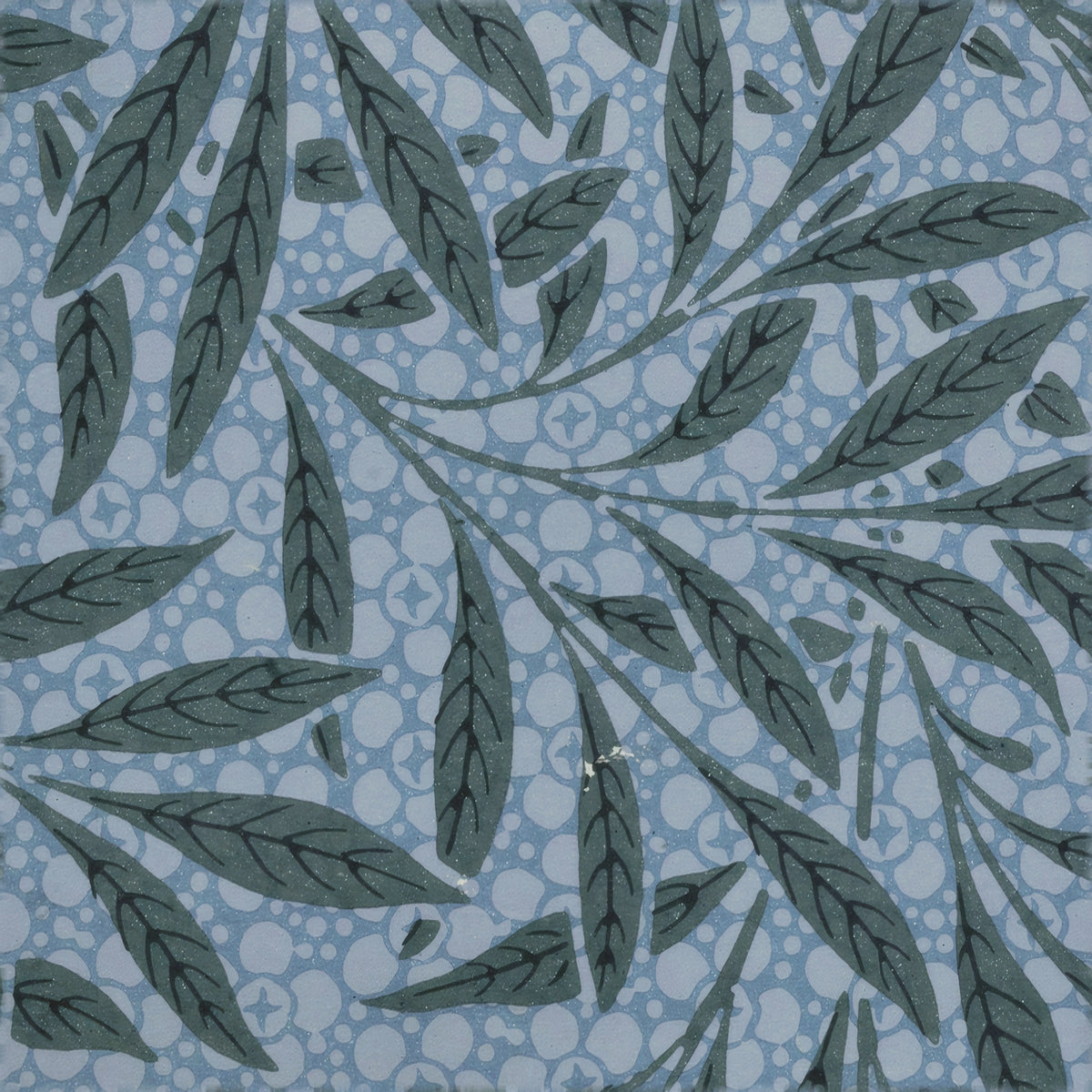 Dark slate willow leaves on curving stems over a dusty-blue ringed ground, a William Morris design.