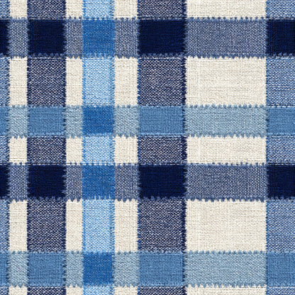 Woven check pattern in navy, cornflower and sky blue on cream with stitched fabric texture.